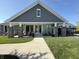 Community center with an outdoor seating area and a manicured lawn at 3443 Thomas Jefferson St, Westfield, IN 46074