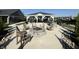 Outdoor gathering space featuring a built-in BBQ, fire pit, and covered picnic tables at 3443 Thomas Jefferson St, Westfield, IN 46074