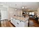 Open concept kitchen with a large center island, stainless appliances, and seamless flow into the living area at 3443 Thomas Jefferson St, Westfield, IN 46074