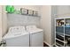 Functional laundry room with modern appliances and ample storage shelves at 3443 Thomas Jefferson St, Westfield, IN 46074