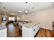 Spacious living area with kitchen island seating, connecting seamlessly to a comfortable lounge area at 3443 Thomas Jefferson St, Westfield, IN 46074
