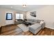 Comfortable living room with a large window, sectional sofa, and neutral tones creating a relaxing atmosphere at 3443 Thomas Jefferson St, Westfield, IN 46074