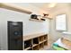 Bright office with floating shelves, gun safe, and a multi-functional workspace at 3443 Thomas Jefferson St, Westfield, IN 46074