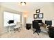 Bright office space featuring two desks, comfortable chairs and large window offering ample natural light at 3443 Thomas Jefferson St, Westfield, IN 46074