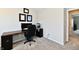 Office with wood-topped desk and neutral walls providing a professional and functional workspace at 3443 Thomas Jefferson St, Westfield, IN 46074