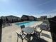 Bright community pool with ample seating, loungers, and a covered patio for shade on sunny days at 3443 Thomas Jefferson St, Westfield, IN 46074