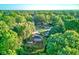 Scenic aerial view of a charming home nestled among lush green trees at 3518 Woodale Rd, Indianapolis, IN 46234