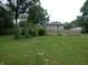 Grassy backyard enclosed by a wooden fence at 3518 Woodale Rd, Indianapolis, IN 46234