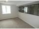 Finished basement area with neutral carpet and shelving at 3518 Woodale Rd, Indianapolis, IN 46234