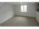 Finished basement area with neutral carpet and paneling at 3518 Woodale Rd, Indianapolis, IN 46234