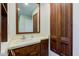 This bathroom features a wooden vanity, mirror and medicine cabinet at 3518 Woodale Rd, Indianapolis, IN 46234