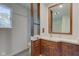 Bathroom featuring a wooden vanity and mirror at 3518 Woodale Rd, Indianapolis, IN 46234