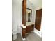 Bathroom boasts wood cabinets and built-in storage at 3518 Woodale Rd, Indianapolis, IN 46234