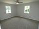 Bright bedroom features neutral carpet, paint, and a ceiling fan at 3518 Woodale Rd, Indianapolis, IN 46234
