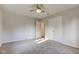 This bedroom features carpet, a ceiling fan, and a walk in closet at 3518 Woodale Rd, Indianapolis, IN 46234