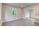 Dining area with wood floors, natural light and open access to the kitchen at 3518 Woodale Rd, Indianapolis, IN 46234