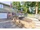 Charming two-story home with a brick and siding exterior, a walkway, and mature landscaping at 3518 Woodale Rd, Indianapolis, IN 46234