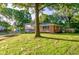Charming two-story home with a brick and siding exterior, a spacious yard, and mature trees at 3518 Woodale Rd, Indianapolis, IN 46234