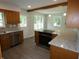 Modern kitchen with stainless steel appliances, light countertops, wood cabinets, and an open design at 3518 Woodale Rd, Indianapolis, IN 46234