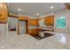 Granite countertops and wooden cabinetry are found in this updated kitchen with modern appliances at 3518 Woodale Rd, Indianapolis, IN 46234