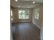 Eat in Kitchen with a view, granite counters, stainless appliances and sleek laminate flooring at 3518 Woodale Rd, Indianapolis, IN 46234