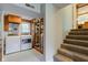 Laundry room with washer, dryer and stairs to the upper level at 3518 Woodale Rd, Indianapolis, IN 46234