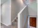 Bright, neutral staircase with carpet steps and white trim, leading to upper levels at 3518 Woodale Rd, Indianapolis, IN 46234