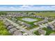 Beautiful aerial view of a residential neighborhood with a serene pond surrounded by lush green lawns at 3650 Merchmont Rd, Bargersville, IN 46106