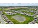 Panoramic aerial view showcasing a community with meticulously maintained lawns and a scenic pond at 3650 Merchmont Rd, Bargersville, IN 46106