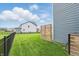 View of the fenced backyard featuring a privacy screen and a well-maintained lawn at 3650 Merchmont Rd, Bargersville, IN 46106