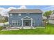 Backyard featuring a covered patio, a cozy seating area, and a lush green lawn at 3650 Merchmont Rd, Bargersville, IN 46106