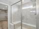Modern glass enclosed shower boasts a showerhead, built-in bench, and window for natural light at 3650 Merchmont Rd, Bargersville, IN 46106