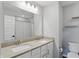 Bathroom features double sinks with modern fixtures, a large mirror, and minimalist decor at 3650 Merchmont Rd, Bargersville, IN 46106