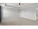 Spacious bedroom with a tray ceiling, recessed lighting, and neutral carpeting throughout at 3650 Merchmont Rd, Bargersville, IN 46106