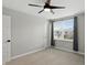 Well-lit bedroom featuring a large window, neutral walls, and a contemporary ceiling fan at 3650 Merchmont Rd, Bargersville, IN 46106