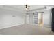 Large bedroom features a tray ceiling, recessed lighting, and ample closet space at 3650 Merchmont Rd, Bargersville, IN 46106