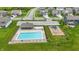 Aerial view of a community pool and playground, perfect for Gathering fun and relaxation at 3650 Merchmont Rd, Bargersville, IN 46106