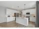 Contemporary kitchen with white cabinets, granite countertops, and stainless steel appliances at 3650 Merchmont Rd, Bargersville, IN 46106