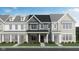 Charming townhome showcasing a stone foundation, gray siding, a black roof, and a covered entryway at 3933 Wren Dr, Brownsburg, IN 46112