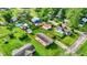 An aerial view of the property shows a well-maintained lawn and a fenced backyard at 405 N Church St, Mooresville, IN 46158
