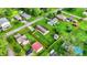 An aerial view of residential properties featuring well-maintained lawns and an assortment of cozy homes surrounded by trees at 405 N Church St, Mooresville, IN 46158