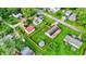 Overhead shot highlighting charming homes, manicured lawns, and lush trees in a desirable residential area at 405 N Church St, Mooresville, IN 46158