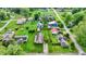 Aerial view of neighborhood showcasing lush green lawns, mature trees, and diverse home styles in a peaceful setting at 405 N Church St, Mooresville, IN 46158