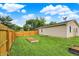 Expansive backyard with wooden fencing, a garden bed, and direct access to the home's exterior at 405 N Church St, Mooresville, IN 46158