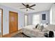 Comfortable bedroom features a spacious closet, wooden floors, and lots of natural light at 405 N Church St, Mooresville, IN 46158