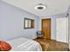 Bright bedroom with wooden floors, a closet and a sofa chair at 405 N Church St, Mooresville, IN 46158