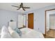 Bright bedroom with view to the bathroom features a spacious closet and wooden floors at 405 N Church St, Mooresville, IN 46158