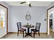 Bright breakfast nook with tiled floor and a view to the exterior at 405 N Church St, Mooresville, IN 46158