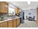 Bright eat-in kitchen with stainless appliances, tile backsplash and floors at 405 N Church St, Mooresville, IN 46158