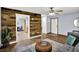 Comfortable living room with hardwood floors, wood accent wall, and views of the interior at 405 N Church St, Mooresville, IN 46158
